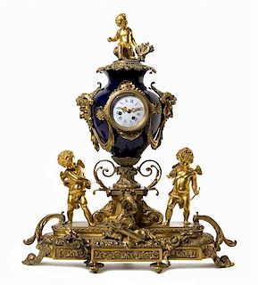 A Napoleon III Gilt Bronze and Porcelain Mantle Clock Height 29 inches.