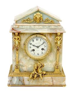 A Tiffany & Co. Retailed Gilt Bronze Mounted Onyx Mantle Clock Height 14 1/4 x width 10 5/8 x depth 6 inches.