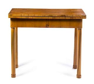 A Biedermeier Flip-Top Game Table Height 31 3/4 x width 37 1/4 x depth 18 inches when closed.