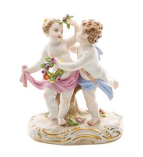 A Meissen Porcelain Figural Group Height 4 3/4 inches.