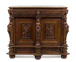 A Dutch Carved Oak Cabinet Height 49 x width 62 x depth 29 inches.