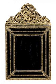 * A Dutch Baroque Style Brass Mirror Height 41 1/2 x width 24 1/2 inches.