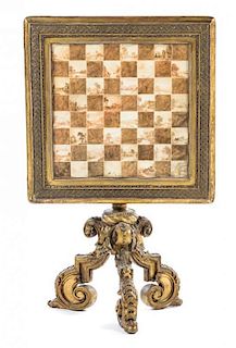 An Italian Baroque Style Giltwood Game Table Height 30 1/2 x width 26 x depth 26 inches.