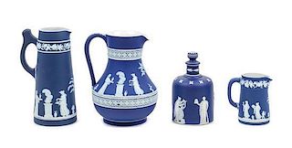 A Group of Four Wedgwood Jasperware Pitchers Height of tallest 7 3/8 inches.