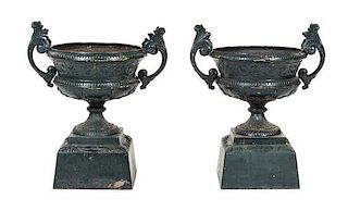 A Pair of Victorian Cast Iron Garden Urns Height 34 inches.
