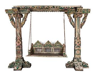 * An Indian Carved and Painted Wood Garden Swing Height 87 x width 116 x depth 29 inches.
