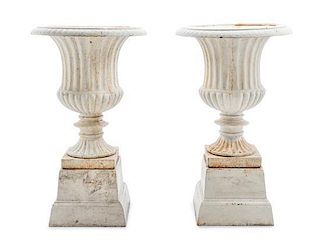A Pair of Victorian Style Cast Iron Garden Urns Height 19 1/2 inches.
