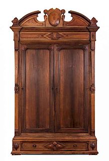 * A Rococo Revival Walnut Armoire Height 113 x width 88 x depth 26 1/2 inches.