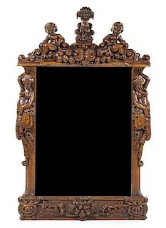A Renaissance Revival Carved Oak Mirror Height 54 1/2 x width 34 3/4 inches.