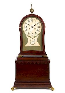 An American Mahogany Mantel Clock on Stand AFTER AARON WILLARD, 20TH CENTURY Height overall 33 inches.
