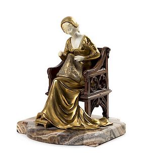 * A French Gilt Bronze, Onyx and Ivory Figure Height 11 7/8 inches.