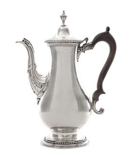 A George III Silver Coffee Pot, Daniel Smith & Robert Sharp, London, 1777, of baluster form with a hinged lid with an urn finial