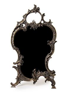* A Louis XV Style Silver-Plate Dressing Mirror, Late 19th Century, of cartouche form with a rocaille frame.