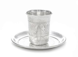 A Russian Silver Beaker, , together with an associated silver saucer.