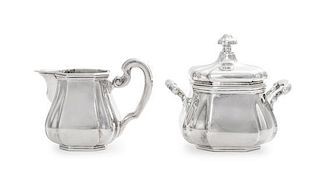 A Continental Silver Creamer and Covered Sugar, Maker's Mark S&F, 20th Century, each of paneled baluster form.