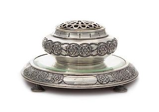 A Portuguese Silver Potpourri and Table Plateau, , the plateau inset with a beveled mirror, both decorated with bands of flowers