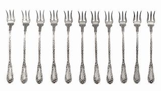 A Set of Eleven Amercian Silver Oyster Forks, Mauser Mfg. Co., New York, NY, each with foliate decoration, monogramed.