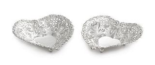 A Pair of American Silver Small Heart Shaped Dishes, Gorham Mfg. Co., Providence, RI, with pierced bowls, raised on three ball f