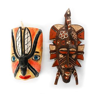 2 TRIBAL CARVED WOODEN HAND COLORED MASKS.