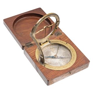 COMPASS. MEXICO, 19th Century. Brass in wooden case and glass cover. 1.1 x 4 x 4" (3 x 10.3 x 10.3 cm)