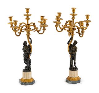 A Pair of Louis XVI Style Gilt and Patinated Bronze Six-Light Candelabra