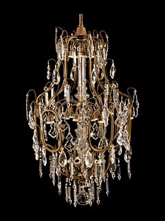 A Neoclassical Gilt Metal and Cut-Glass Cage Form Twelve-Light Chandelier
