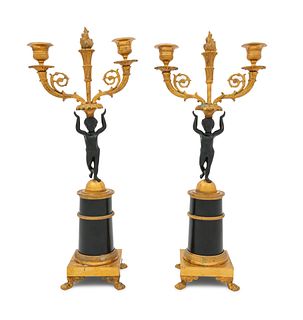 A Pair of Empire Gilt and Patinated Bronze Figural Candlesticks