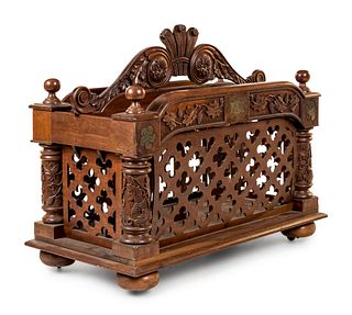 An Oversized Carved Walnut Canterbury 