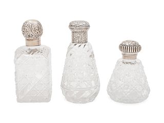 Three Victorian Silver Mounted Cut Glass Bottles