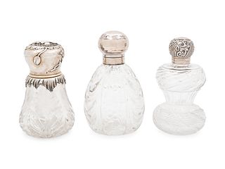 Three Silver Mounted Cut Glass Bottles