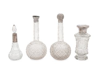 Four English Silver Mounted Cut Glass Bottles