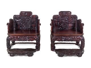 A Pair of Chinese Export Carved Hardwood Armchairs and Footrests