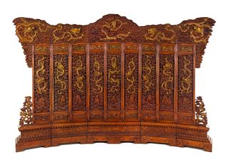 A Large Chinese Export Carved Hardwood 'Dragon and Clouds' Screen