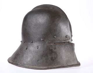 A SALLET, formed in one piece, with raised metal ridge. 38cm front to back