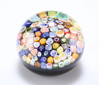A 19TH CENTURY CLOSE-PACK MILLEFIORI GLASS PAPERWEIGHT, with various multi-