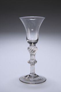 A MULTI-SPIRAL AIR-TWIST WINE GLASS, CIRCA 1750, the bell-shaped bowl sat o