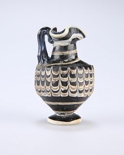 A RARE GREEK CORE-FORMED GLASS OINOCHOE, CIRCA 1ST-4TH CENTURY BC, the bott