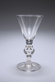 A LARGE VICTORIAN GLASS RUMMER IN THE FORM OF A GEORGIAN HEAVY BALUSTER GLA