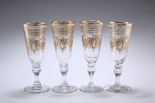 A SET OF FOUR BOHEMIAN GILDED WINE GLASSES, CIRCA 1785, the deep slender bo
