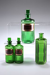 FOUR LATE VICTORIAN GREEN GLASS APOTHECARY BOTTLES,?with moulded ribbed bod