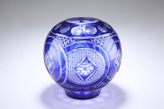 A LARGE BOHEMIAN BLUE OVERLAY GLASS VASE, ball-shaped, decorated with six c