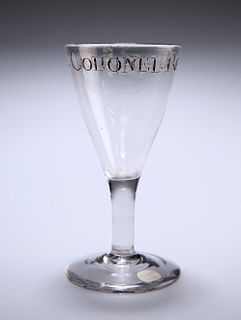 AN ENGLISH DRINKING GLASS, CIRCA 1780,?with a funnel bowl engraved to the b