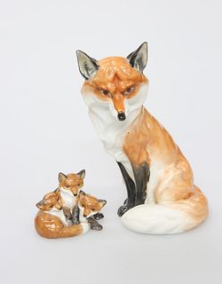 A ROYAL WORCESTER MODEL OF A SEATED FOX, no. 2993, 18.5cm; together with A 