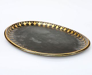 A LARGE VICTORIAN TOLEWARE TRAY, oval with gilded decoration. 74.5cm by 57.