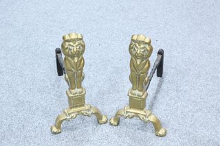 A PAIR OF 19TH CENTURY BRASS LION ANDIRONS. 43.5cm high