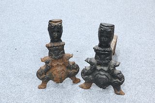 A PAIR OF CAST AND WROUGHT IRON ANDIRONS, each with a female mask surmount.