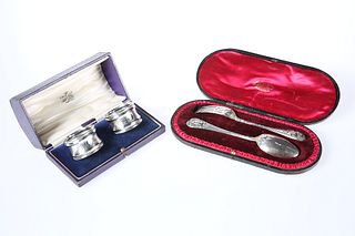 A CASED PAIR OF SILVER NAPKIN RINGS, BIRMINGHAM 1919, the waisted rings wit