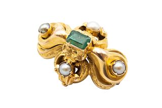 A MID 19TH CENTURY EMERALD AND HALF PEARL BROOCH
 The scrolling frame with 