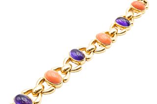 AN AMETHYST AND CORAL BRACELET, BY CARTIER 
 Alternately set with cabochon 