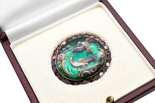 A MID 18TH CENTURY ENAMEL AND GARNET CLASP
 The oval-shaped enamel plaque d
